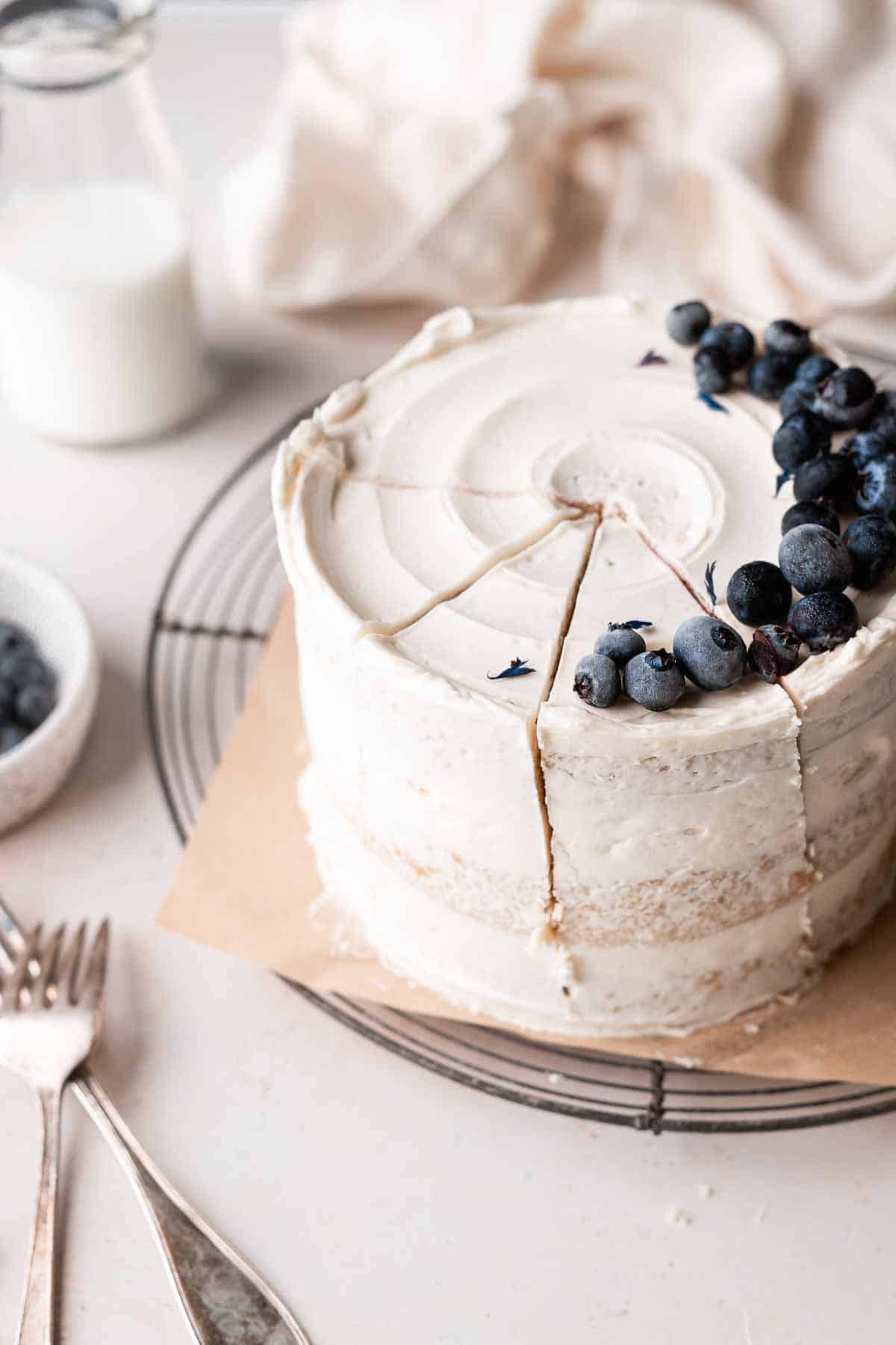 earl grey cake with blueberries on top.