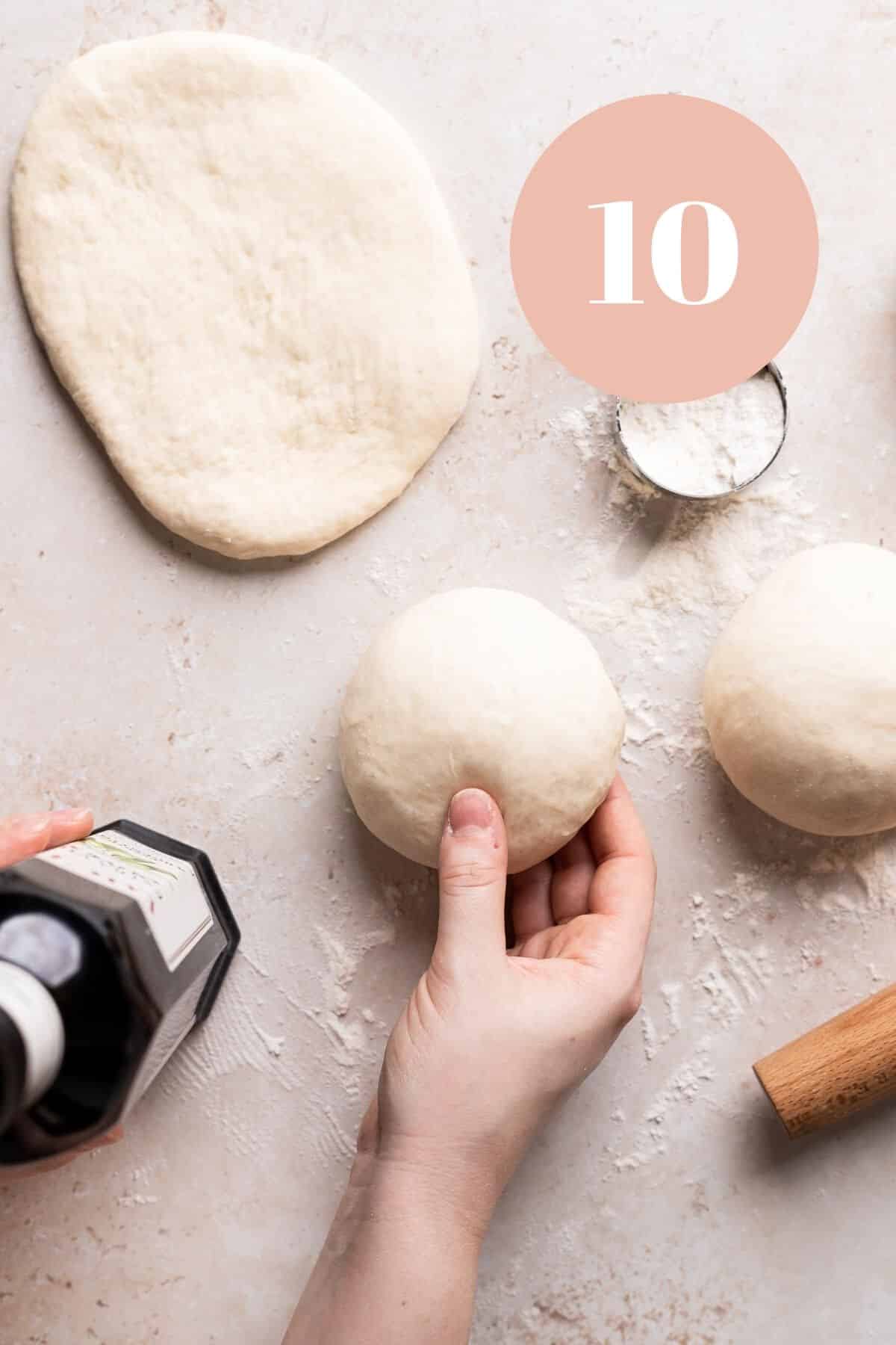 stretching the chewy italian pizza dough balls.