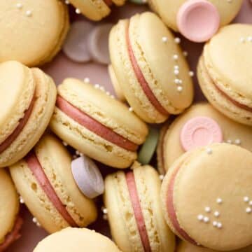 sweet tart macarons in a pile together.