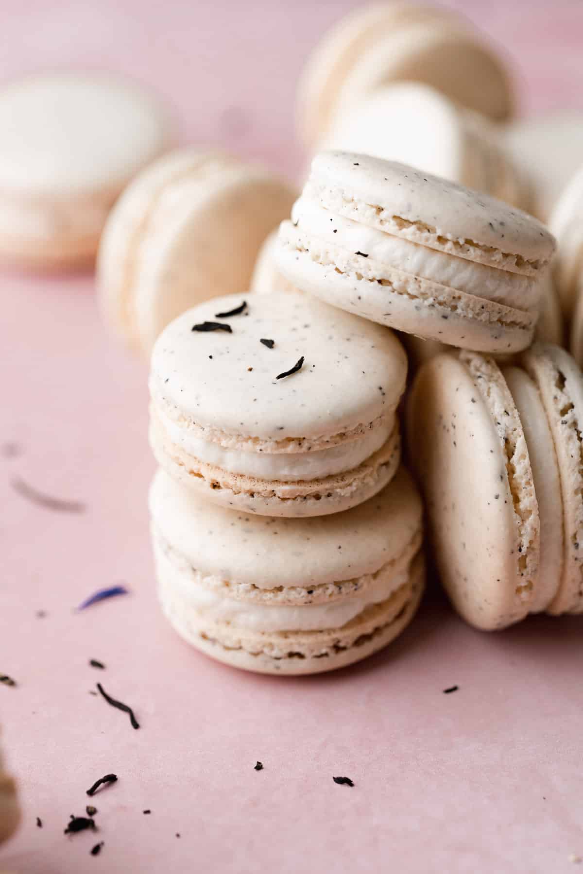 earl grey tea macarons stacked on top of each other.