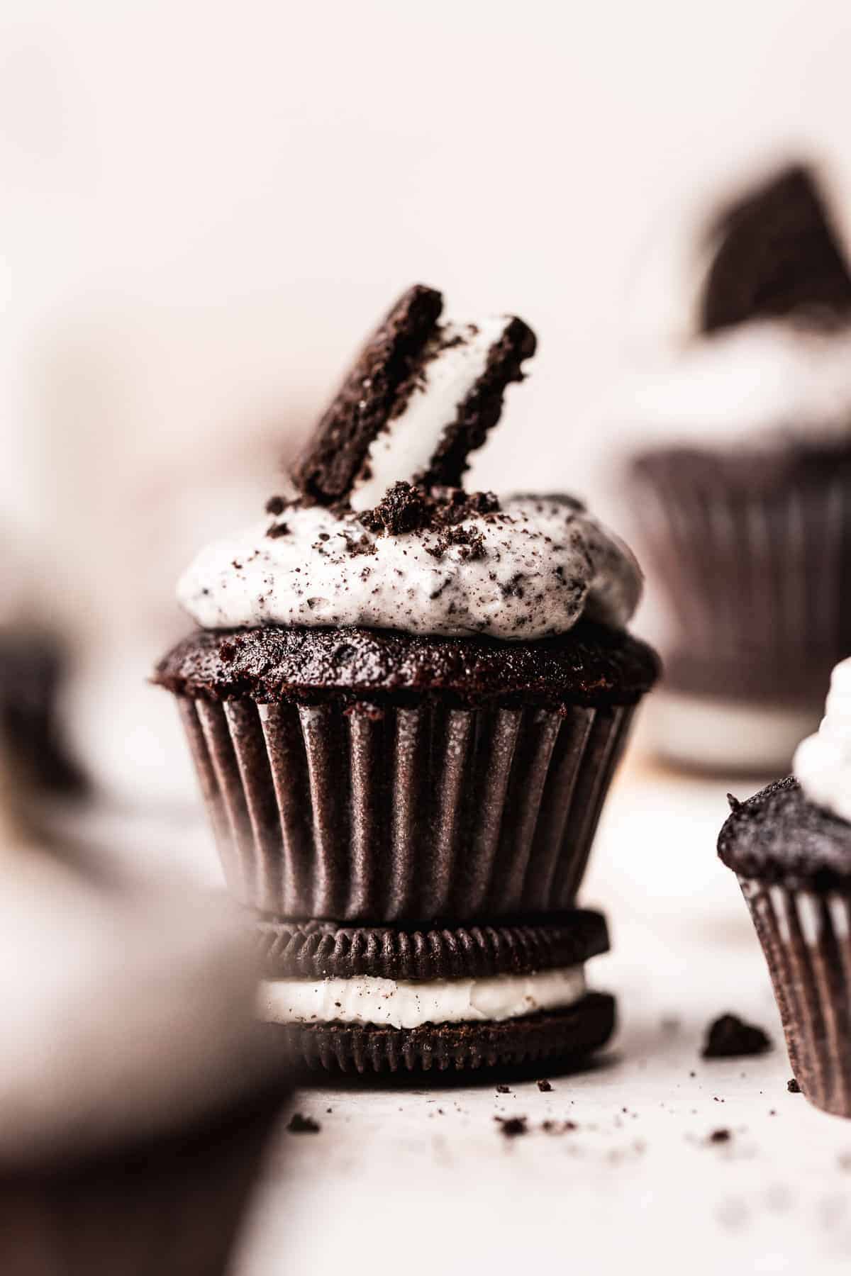 a mini chocolate cupcake topped with an oreo.