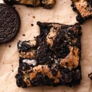 an oreo brookie with a bite taken out of it.