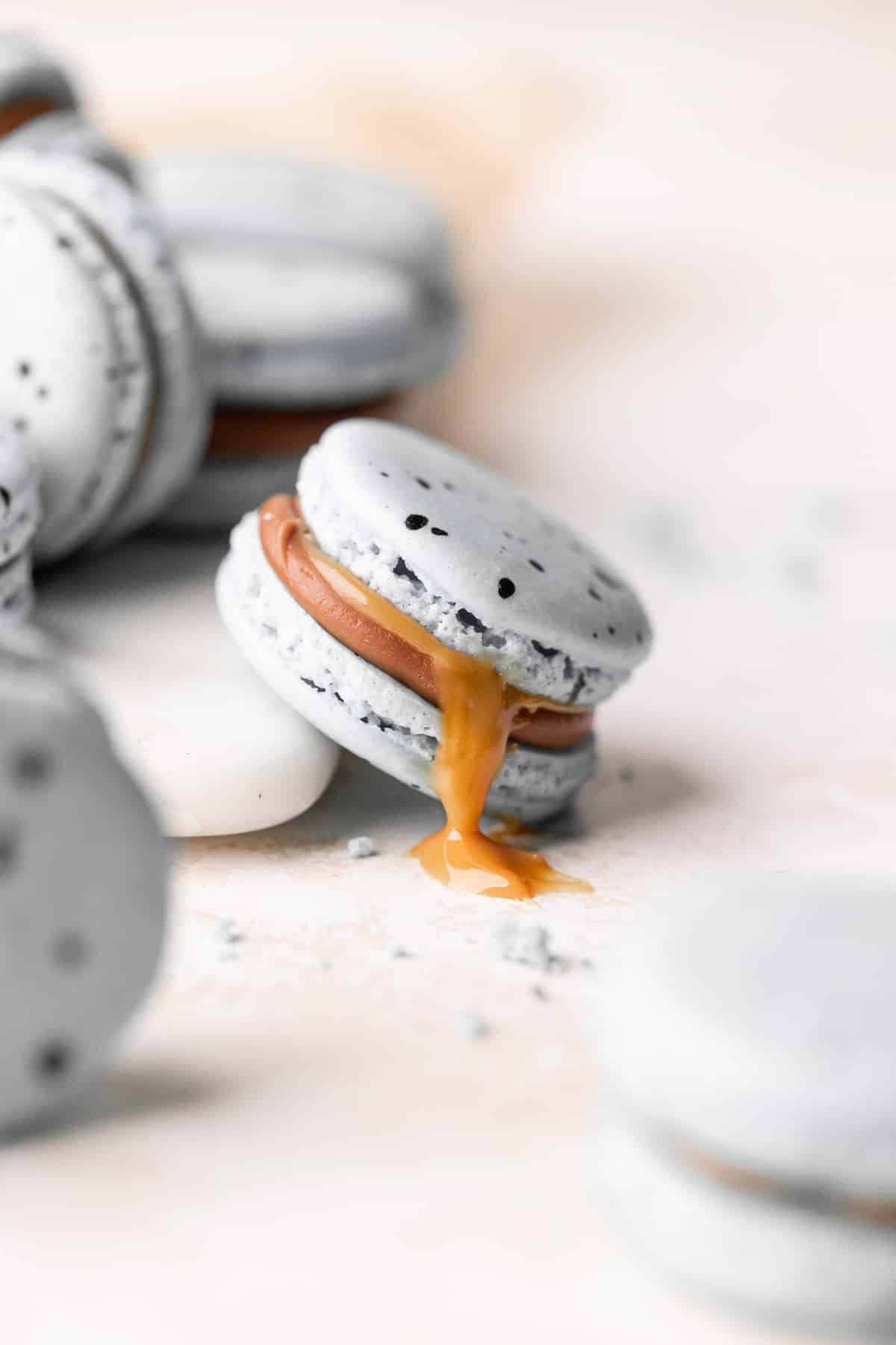 an easter egg macaron on its side.
