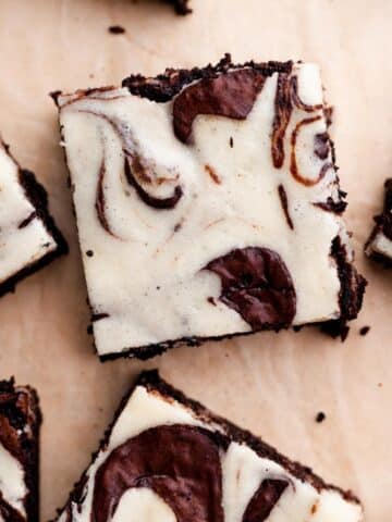 cheesecake marble brownie on a piece of parchment paper.