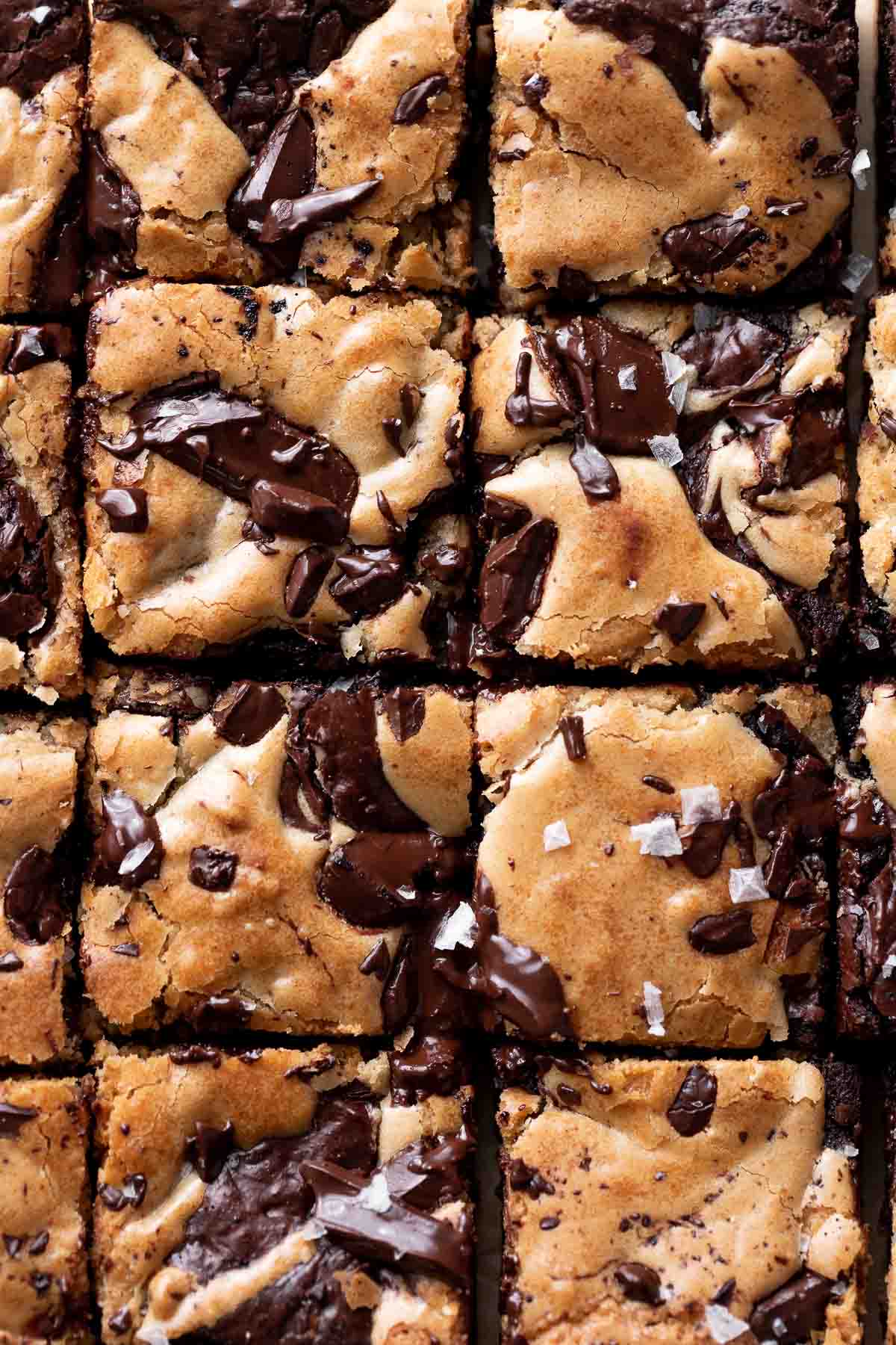 a close up of the tops of the blondie brownies showing the melted chocolate.