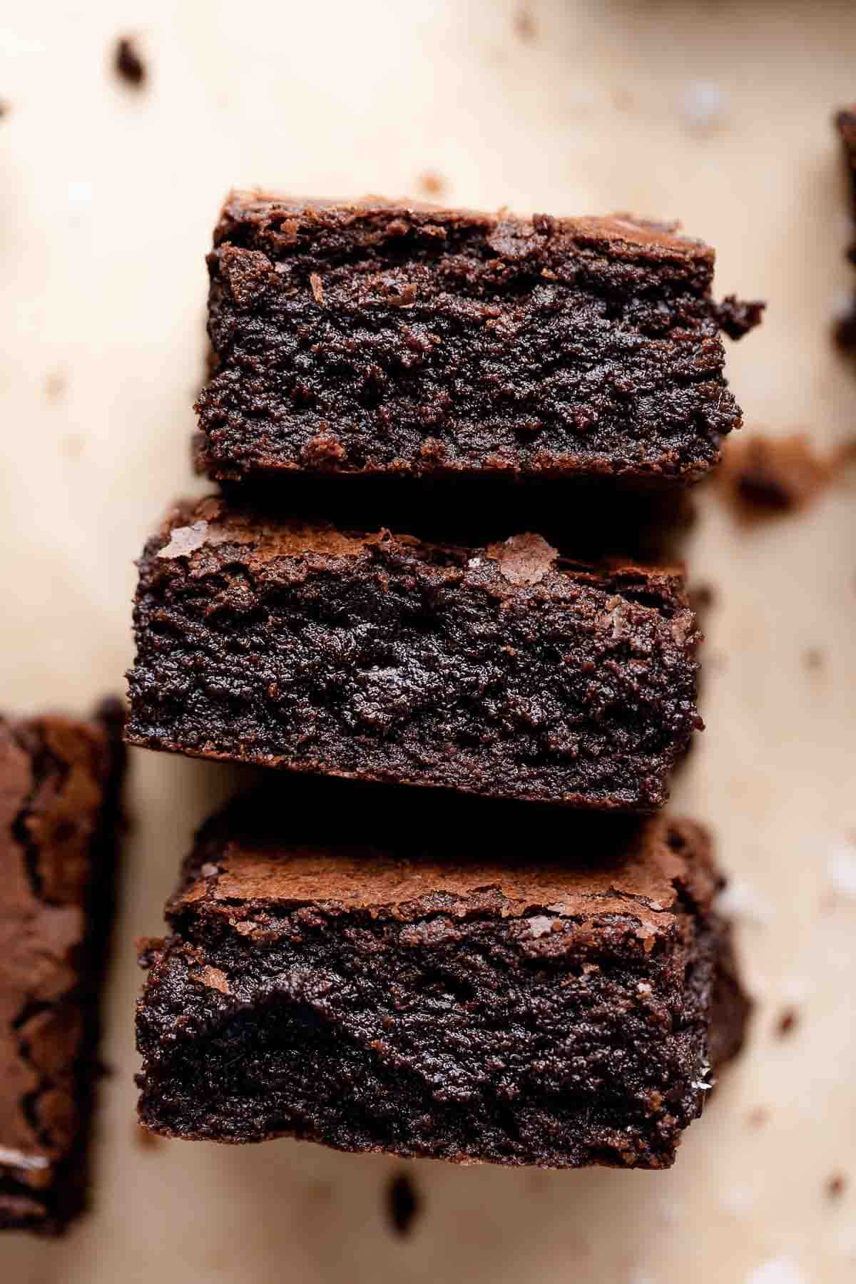 three espresso brownies stacked on each other.