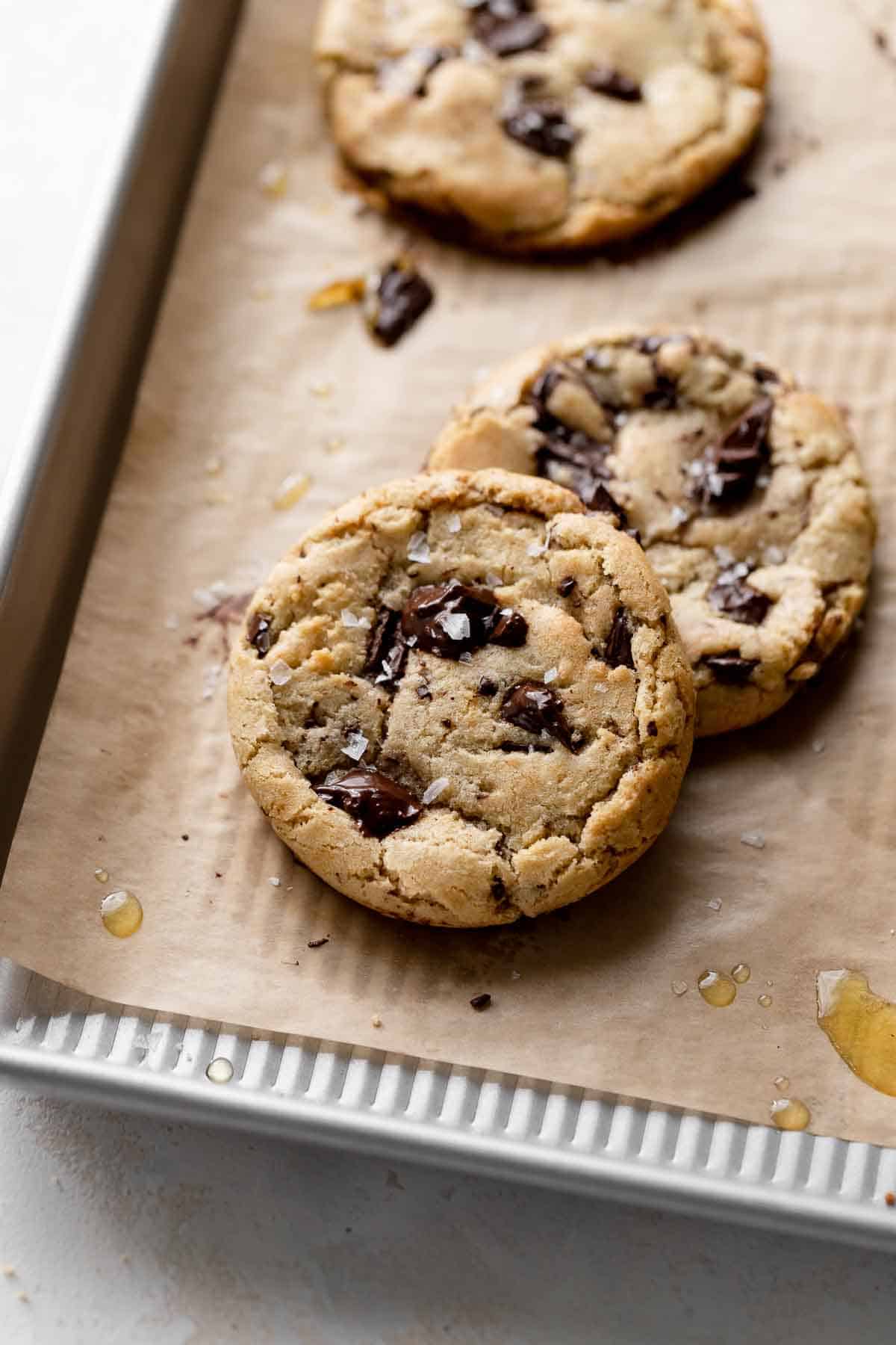 chocolate chip olive oil cookies on a baking tray.