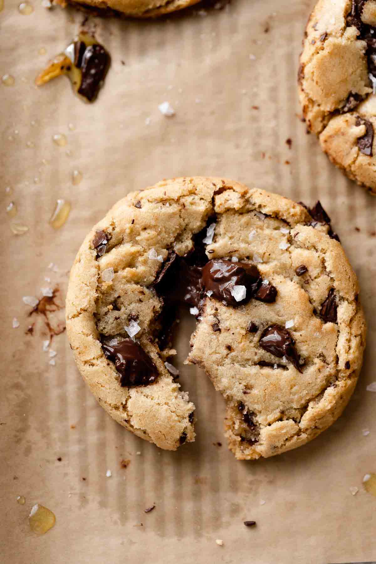 a chocolate chip olive oil cookie broken in half.