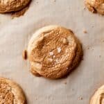 biscoff butter cookies on parchment topped with speculoos butter.