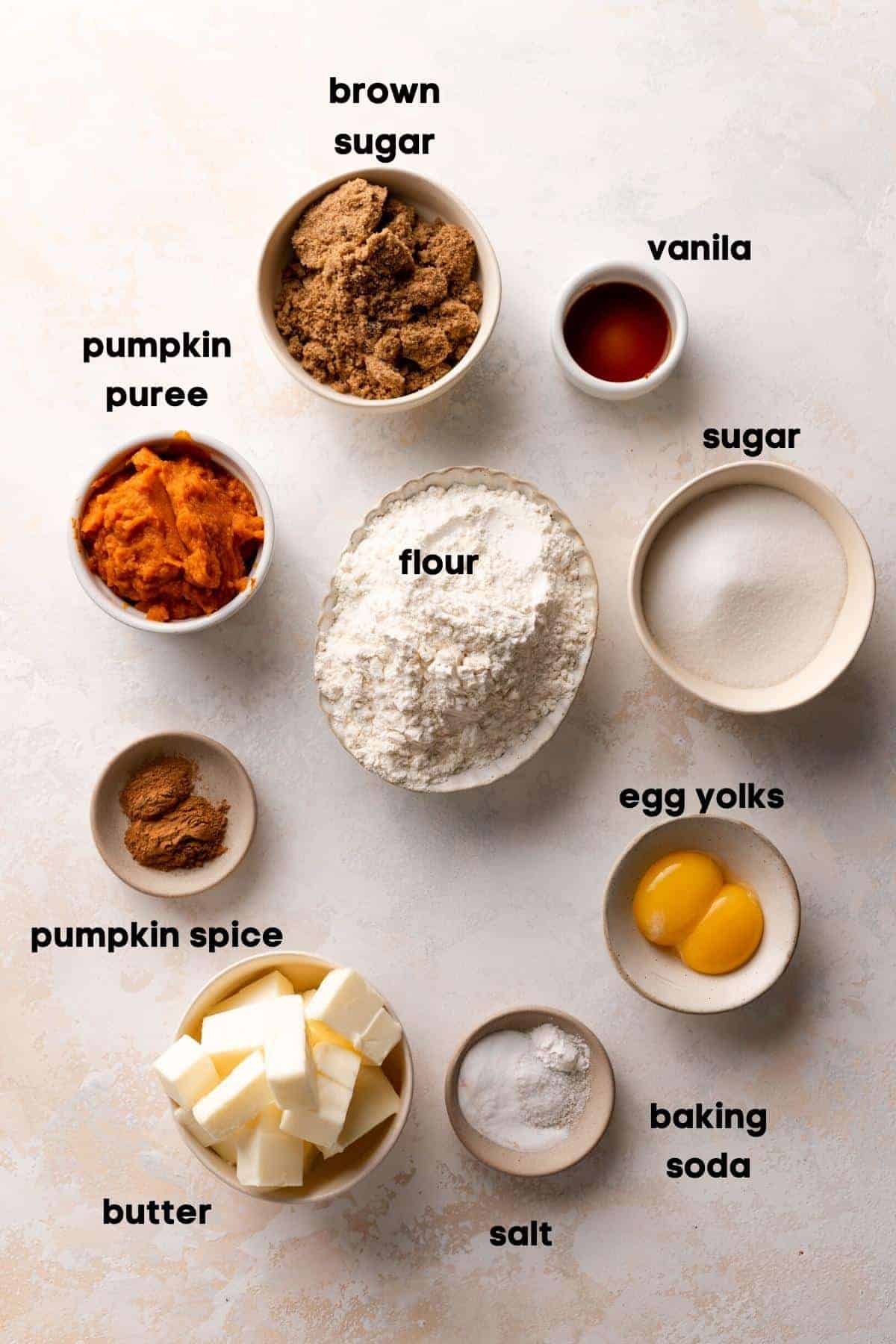 ingredients needed to make pumpkin snickerdoodles in bowls with labels.