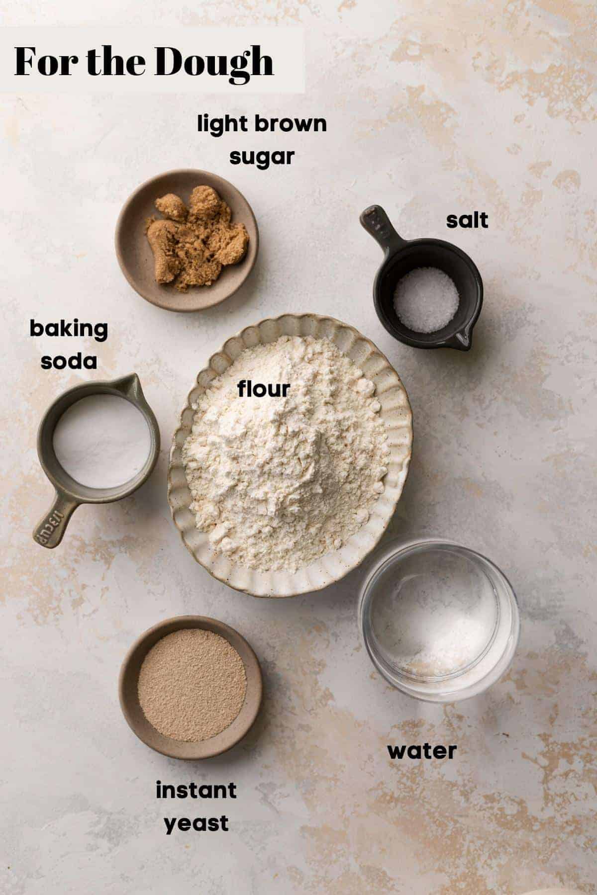 ingredients needed for the soft pretzel dough in bowls.