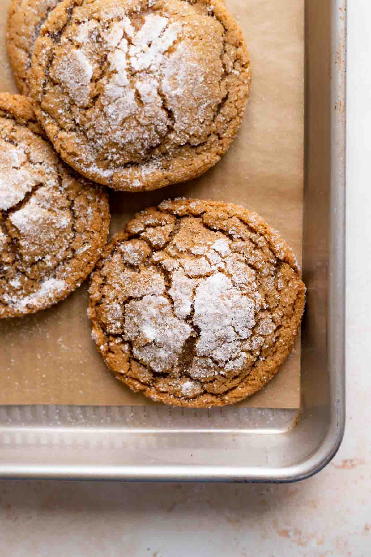 molasses crinkle cookies on a baking tray.