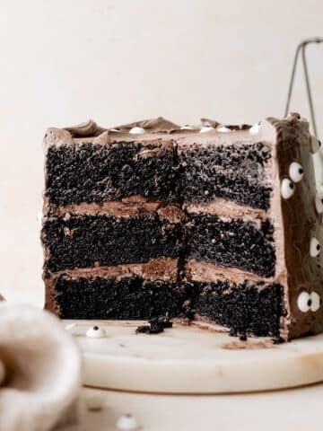 black velvet cake cut in half to show the black cocoa cake.