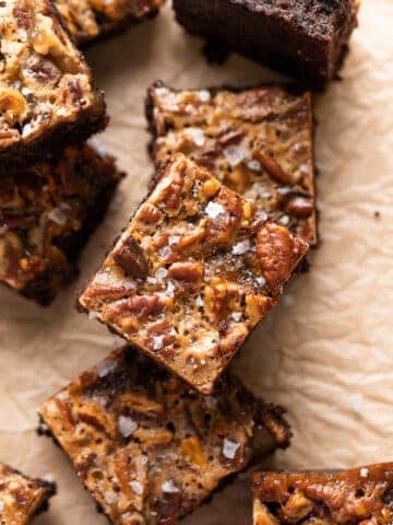 bourbon pecan pie brownies cut into squares on a baking tray.