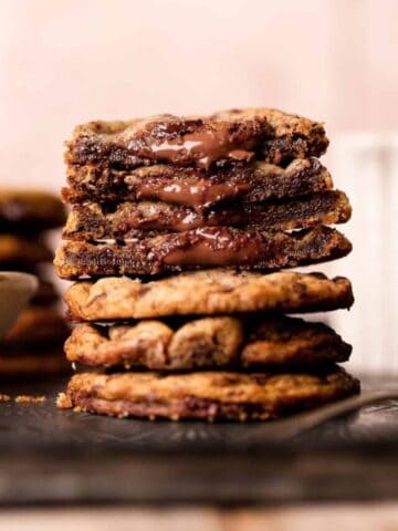 chocolate filled cookies cut in half with nutella oozing out of the centers.