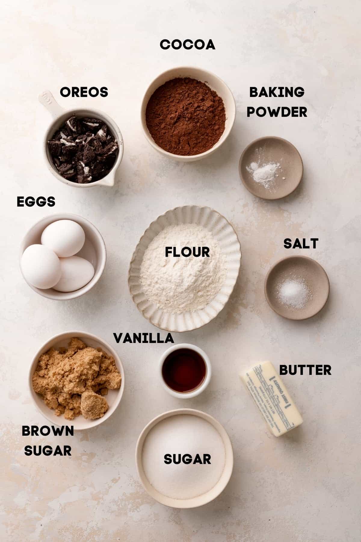 ingredients needed to make oreo brookies in bowls with labels.
