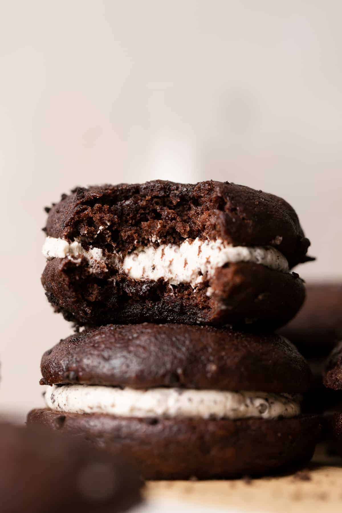 two oreo whoopie pies stacked on top of each other.