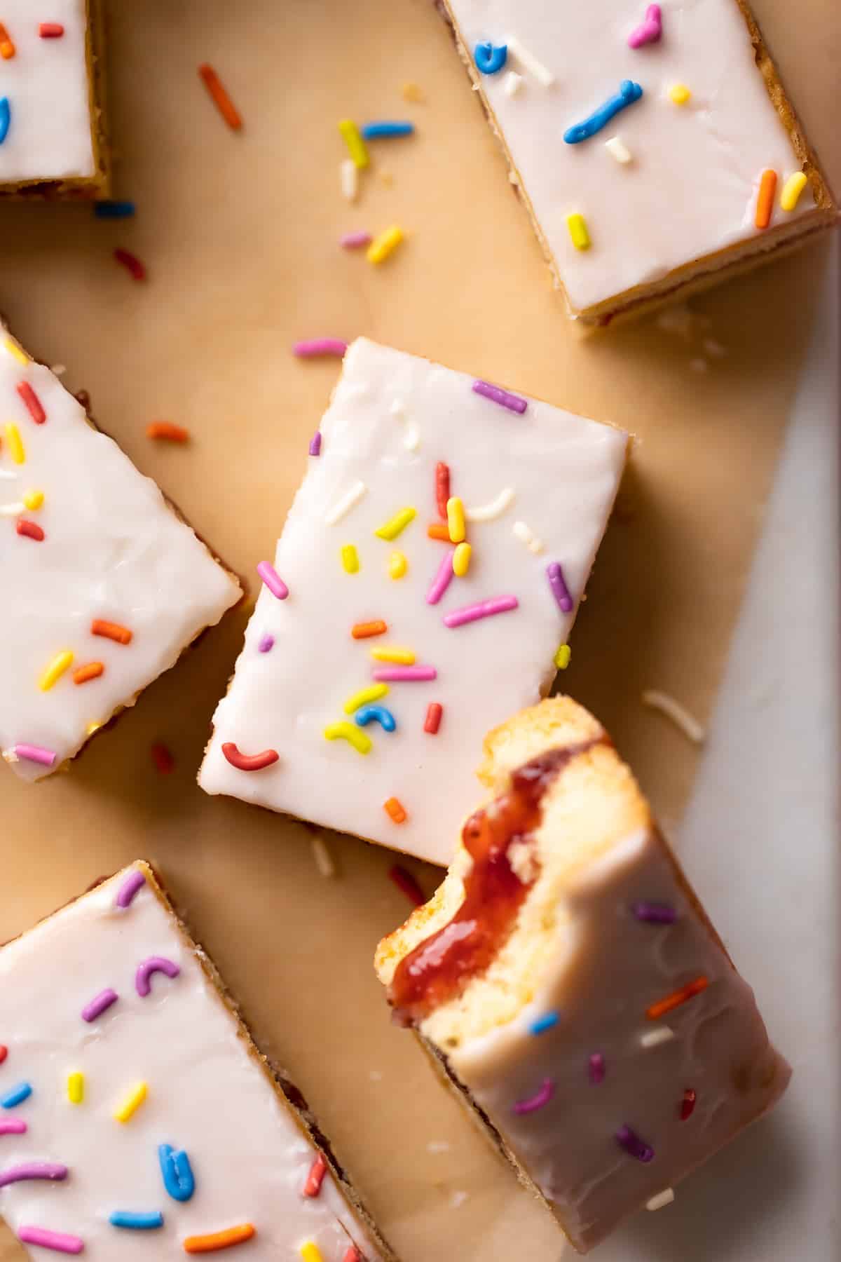 pop tart cookie bars with vanilla glaze and rainbow sprinkles.
