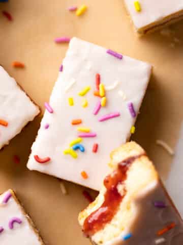 pop tart cookie bars with vanilla glaze and rainbow sprinkles.