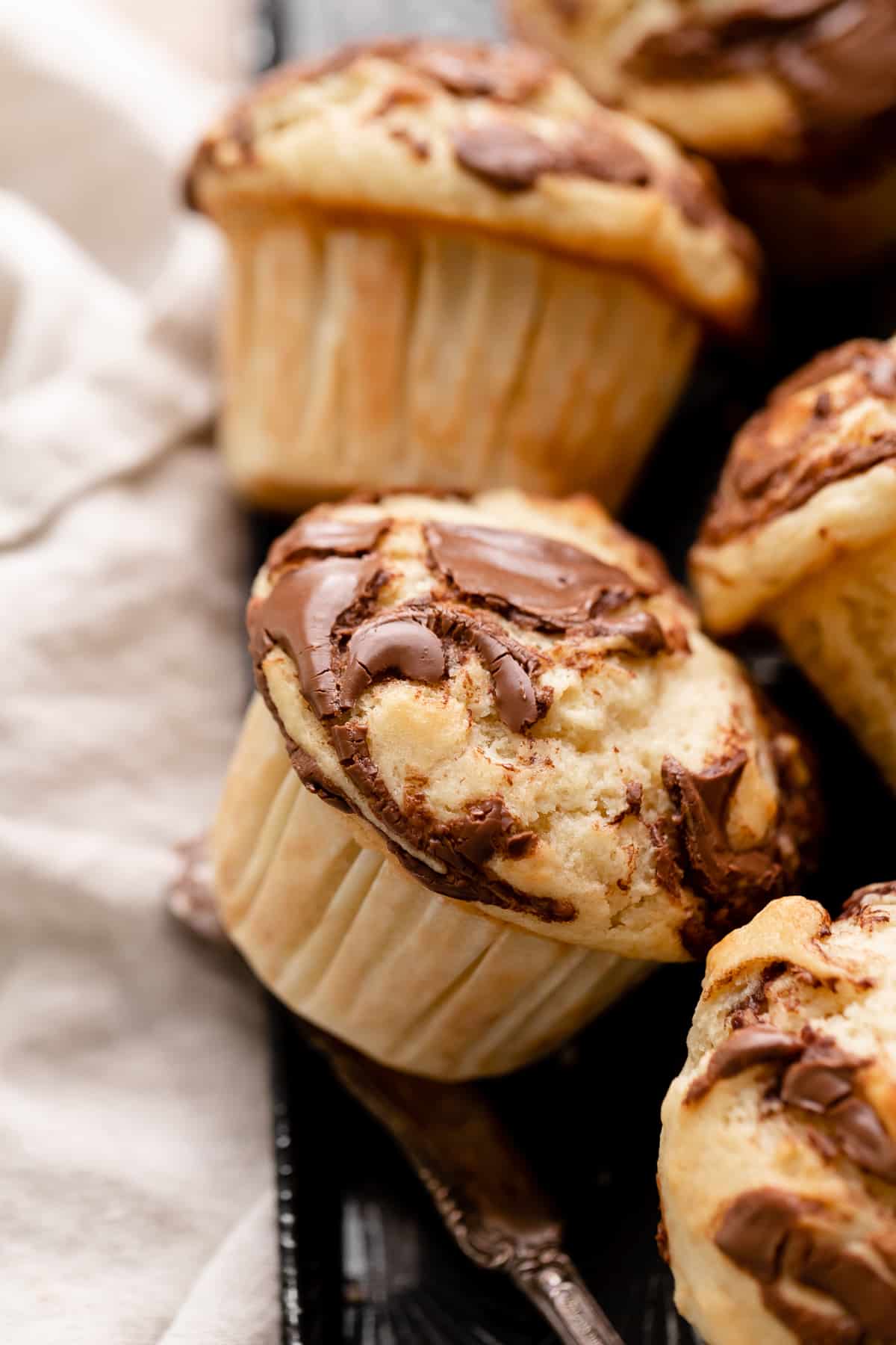 nutella banana muffin with swirled nutella on top.