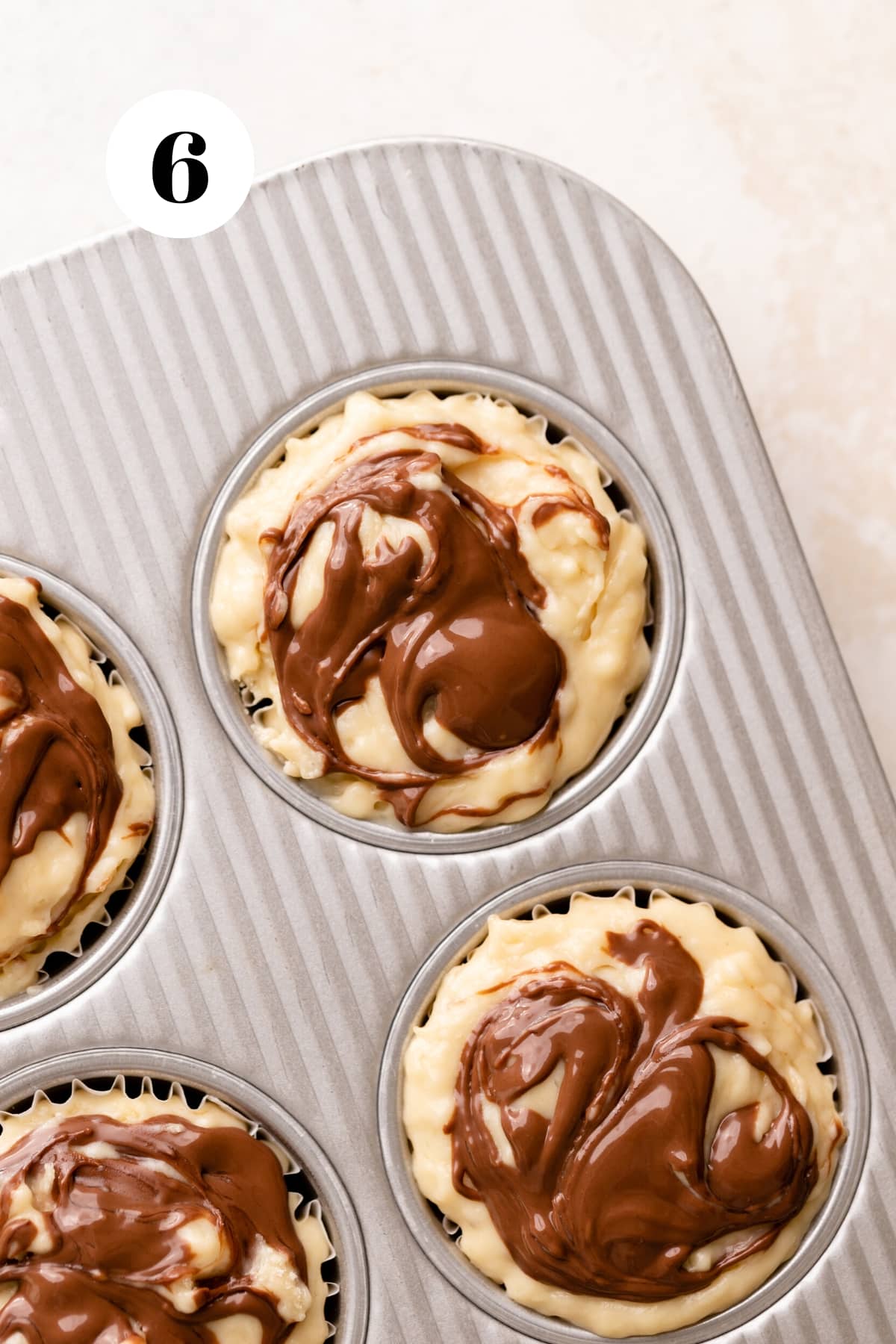 banana muffins with a swirl of nutella on top before baking.