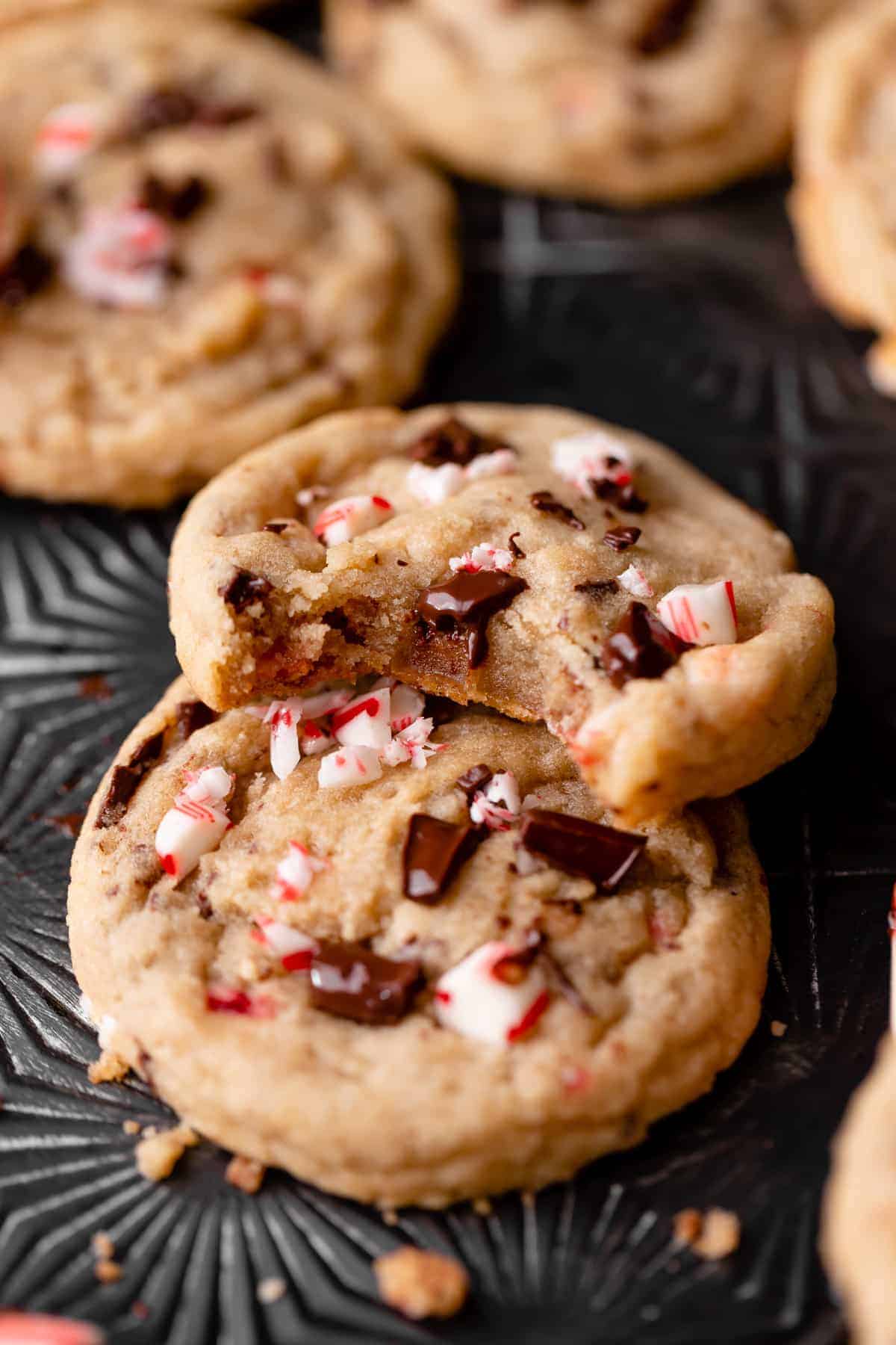 chocolate chip peppermint cookie with a bite taken out of it.