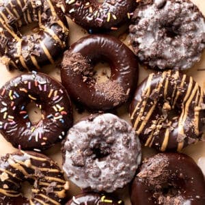 chocolate donuts on parchment paper.
