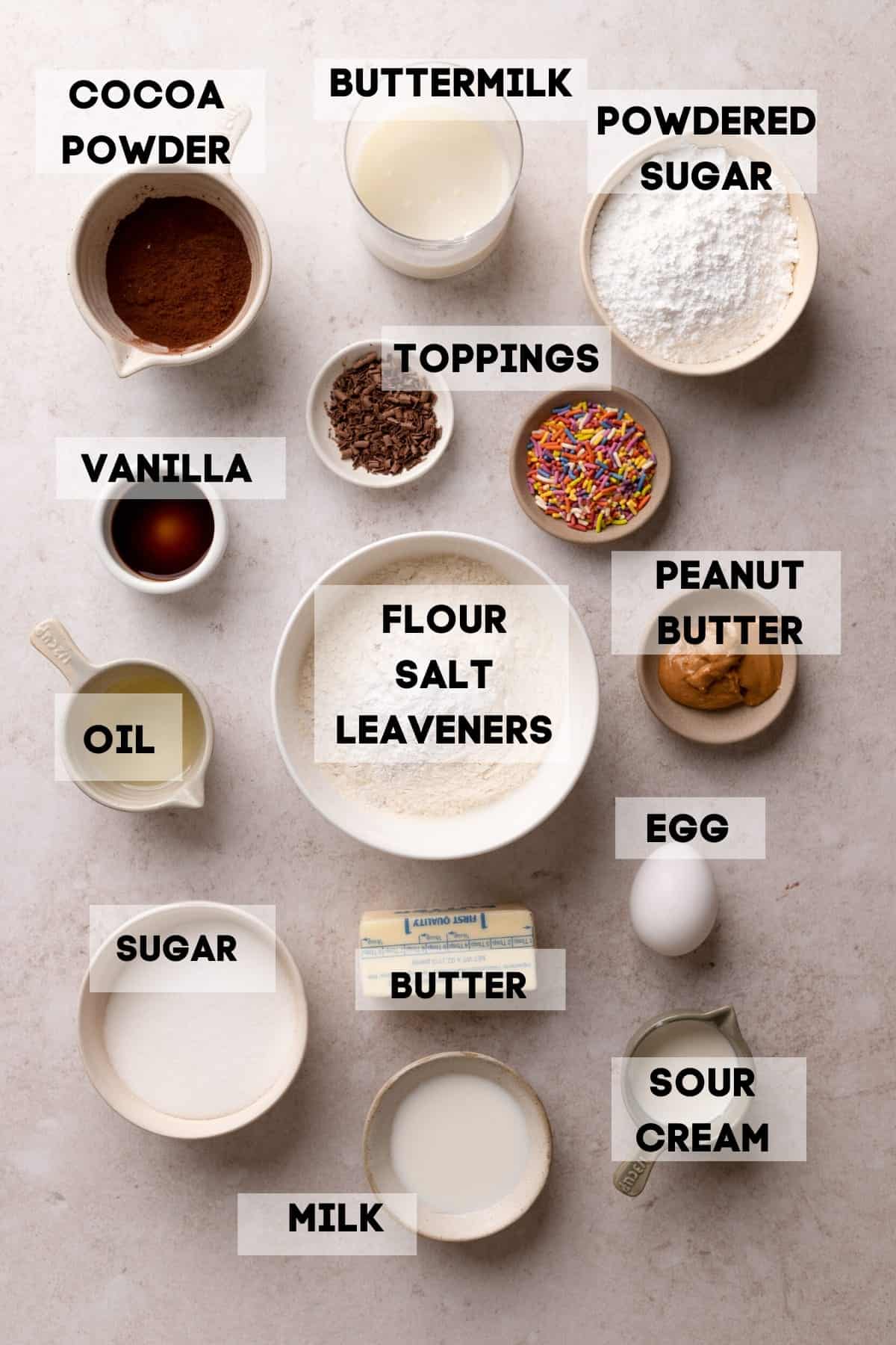 ingredients needed to make baked donuts in bowls with labels.
