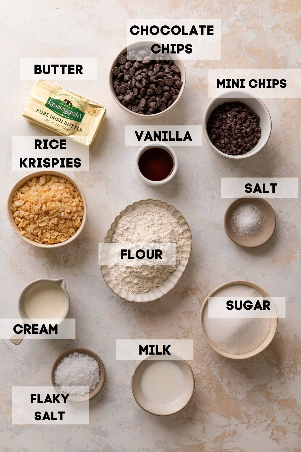 ingredients needed to make cookie dough bars in bowls with labels.