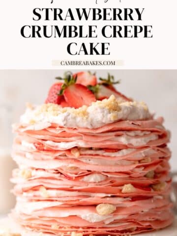 strawberry crepe cake topped with whipped cream.
