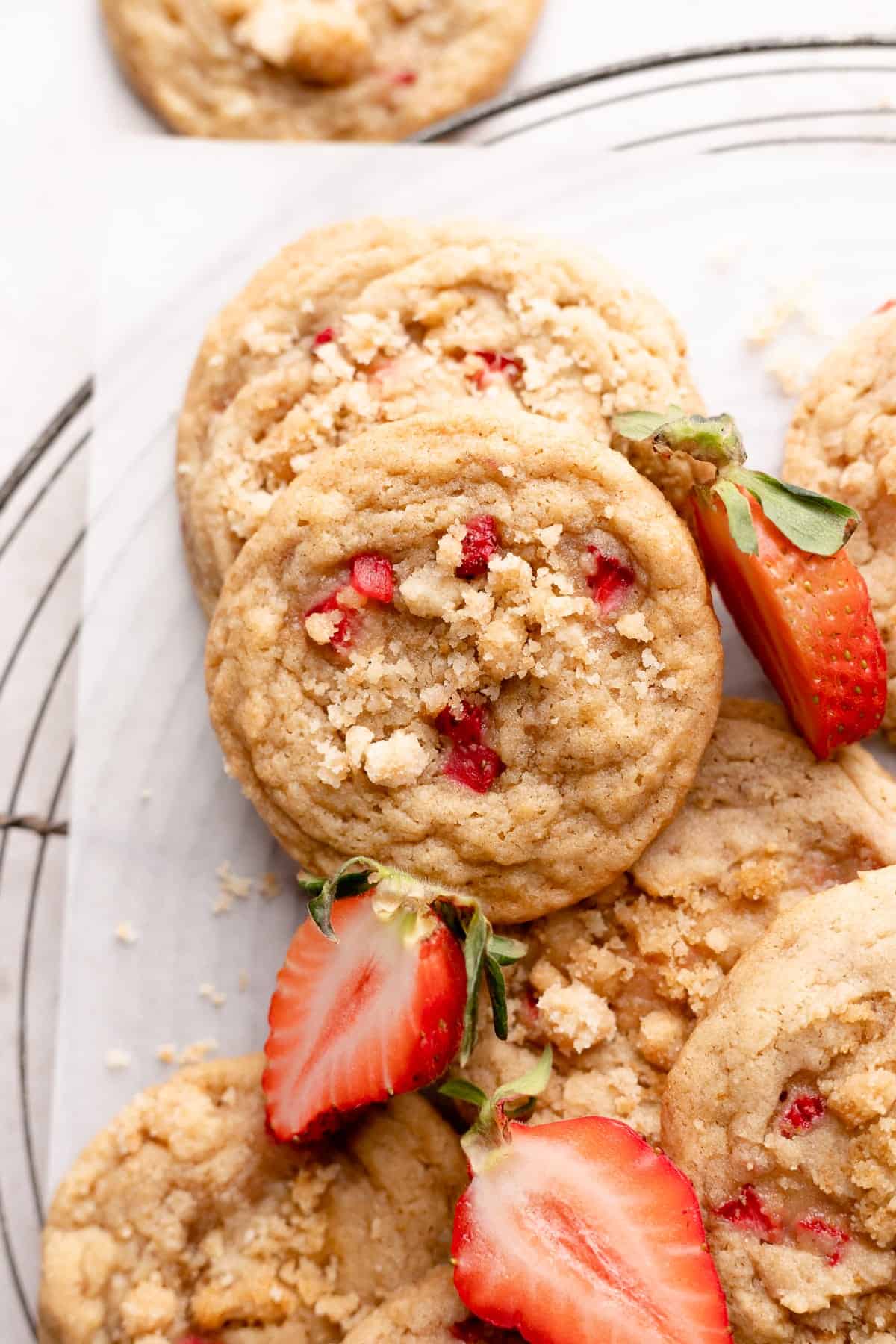 strawberry shortcake cookies on parchment paper.
