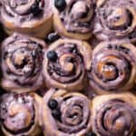 blueberry cinnamon rolls with blueberry glaze on top.