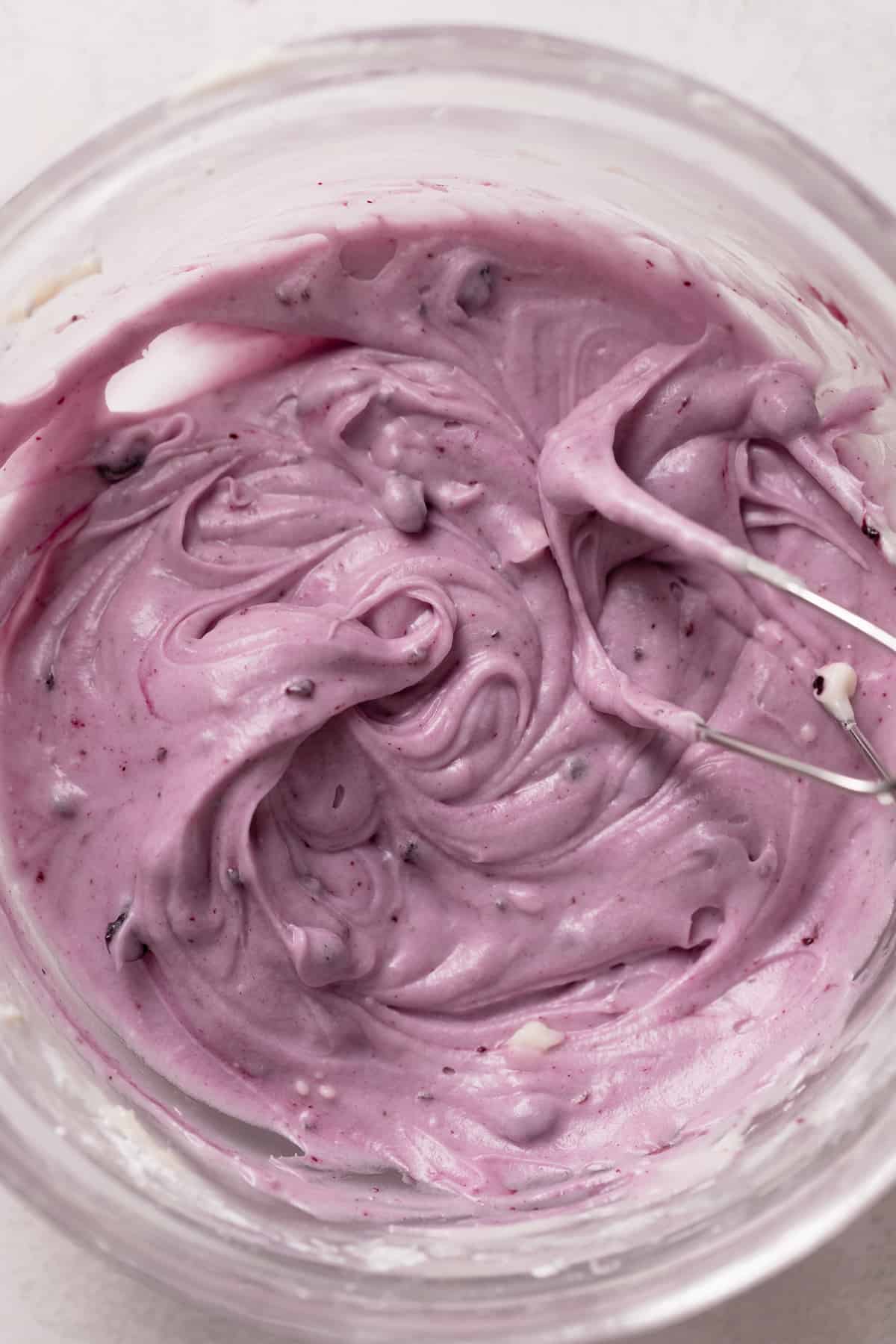 blueberry cream cheese frosting in a mixing bowl.