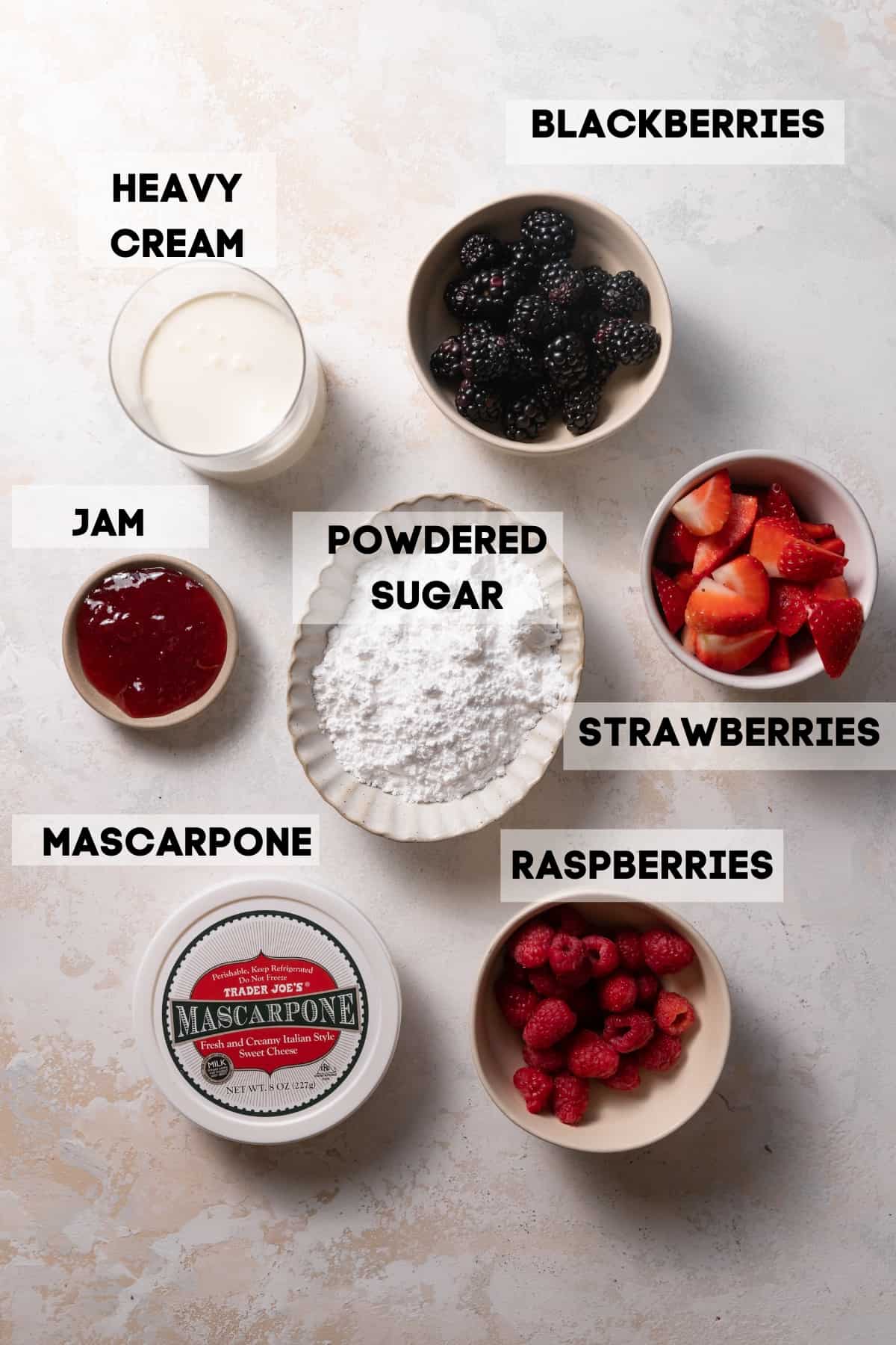ingredients needed to make mascarpone cake in bowls with labels.