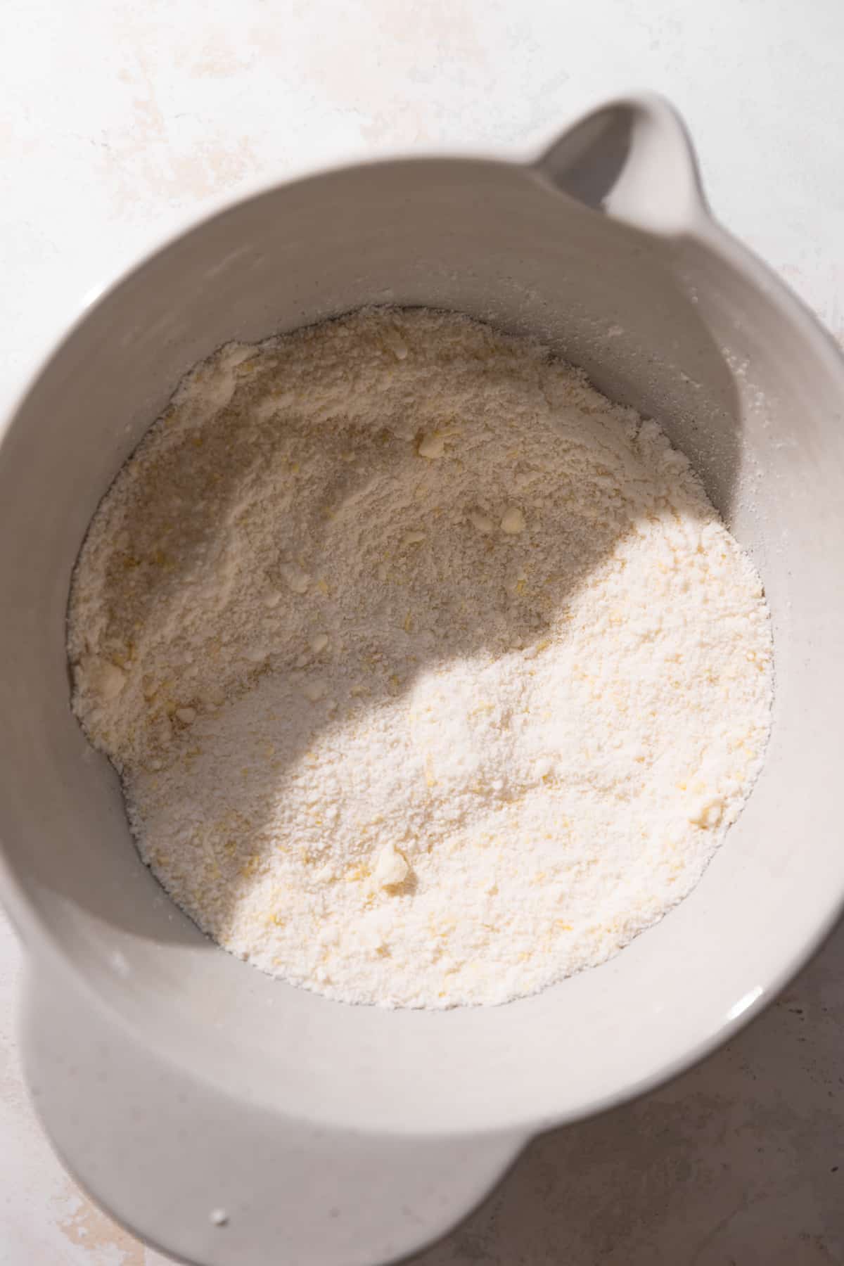 a bowl of the dry ingredients and butter mixed together.