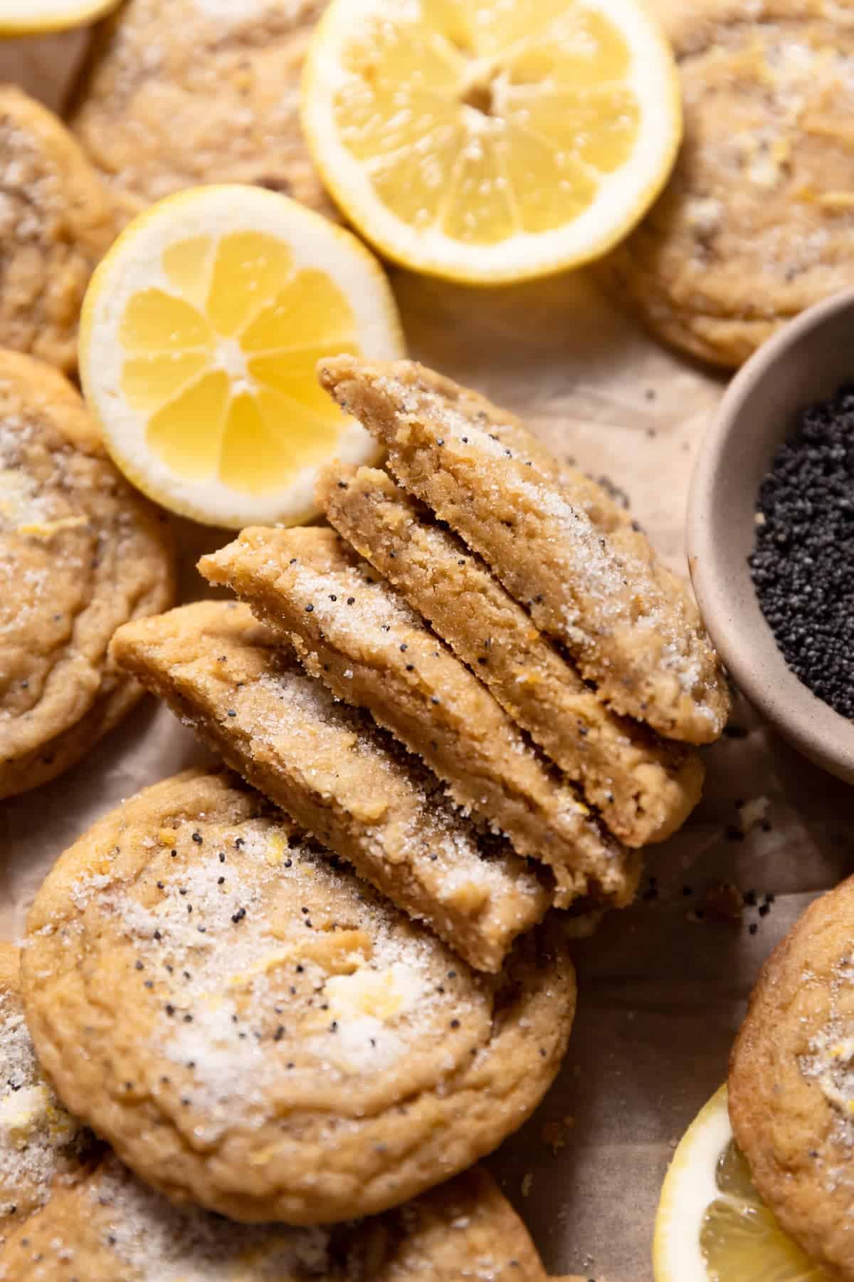 lemon poppy seed cookies cut in half to show their chewy texture.
