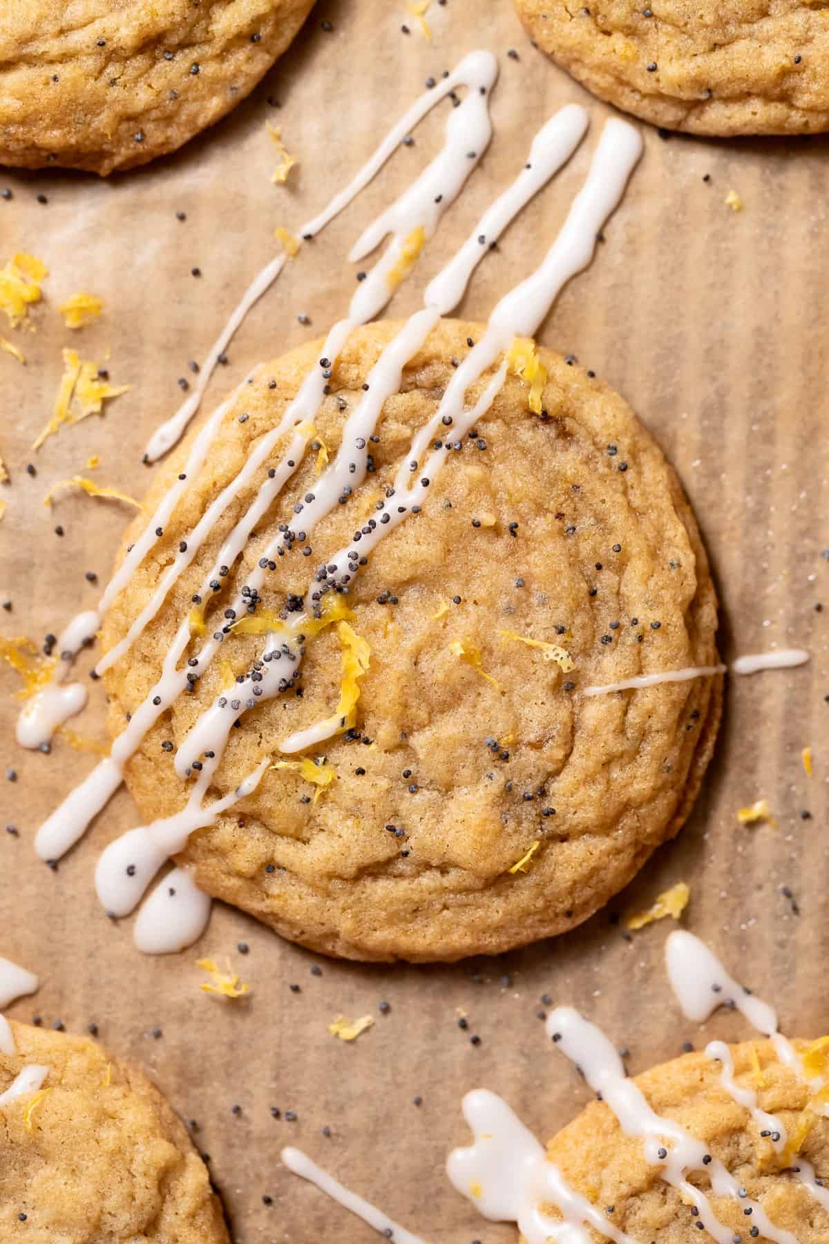 lemon poppy seed cookie with lemon glaze drizzled on top.