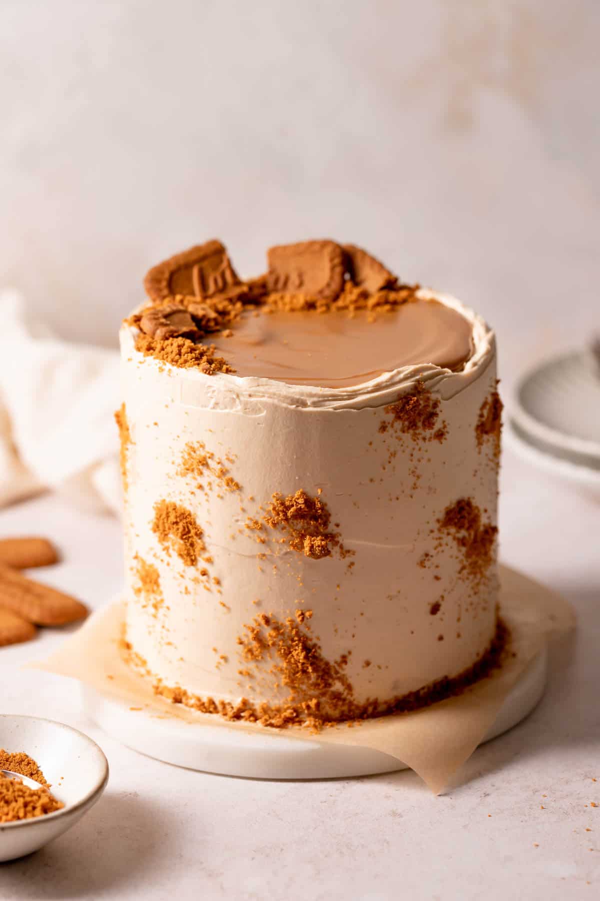 cookie butter cake with cookie butter and cookies on top.