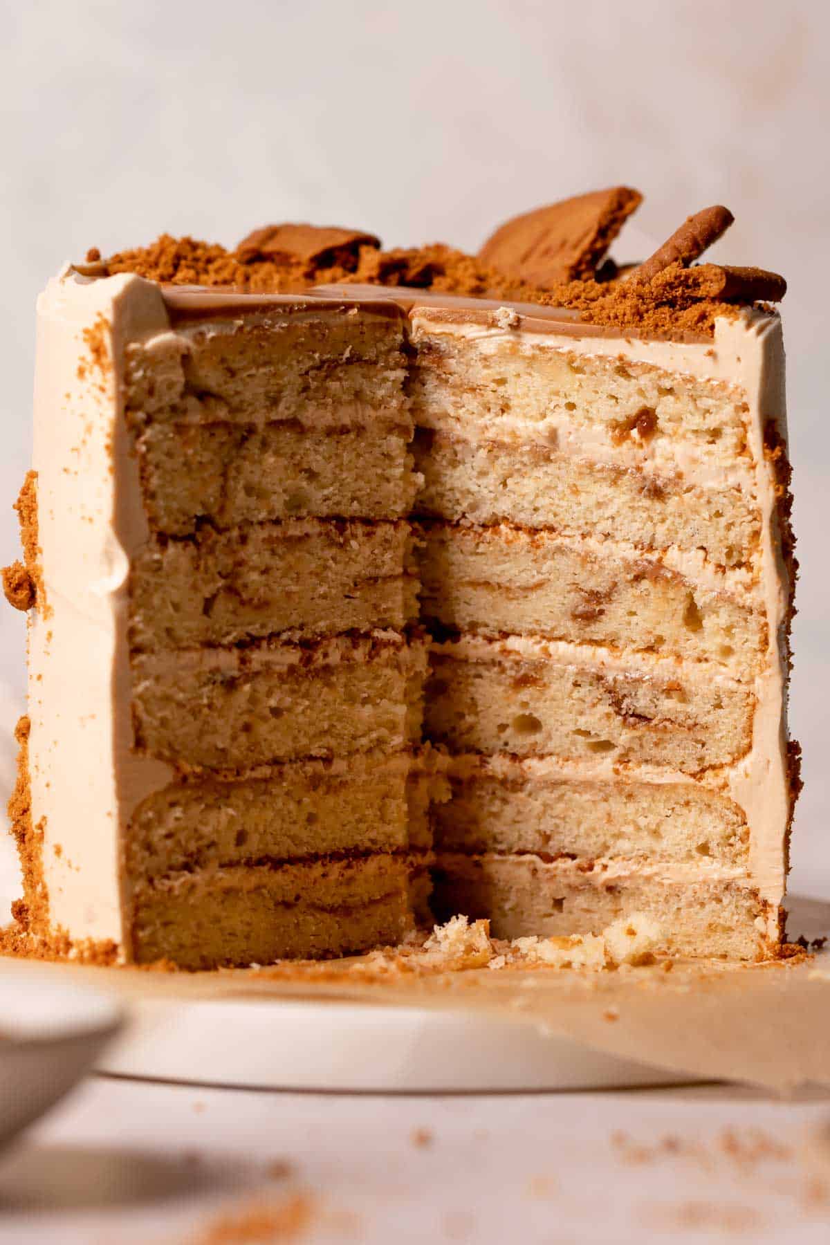 biscoff cake cut in half to show the cookie butter swirled cake layers.
