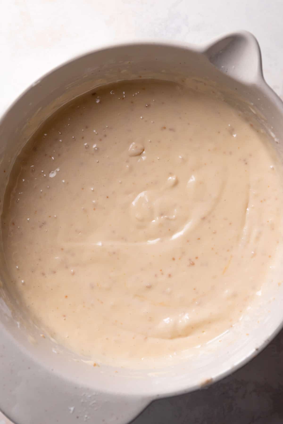 cookie butter cake batter in a mixing bowl.