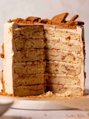 biscoff cake cut in half to show the cookie butter swirled cake layers.