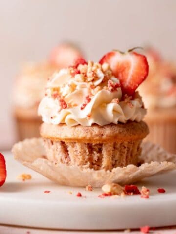 strawberry shortcake cupcake with a liner pulled down.