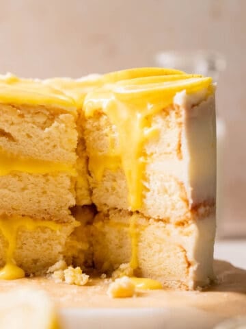 lemon bar cake with lemon curd and fresh lemon slices.
