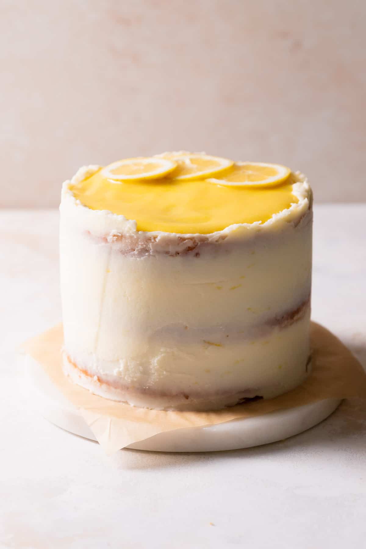 the decorated lemon bar cake on a white marble slab.