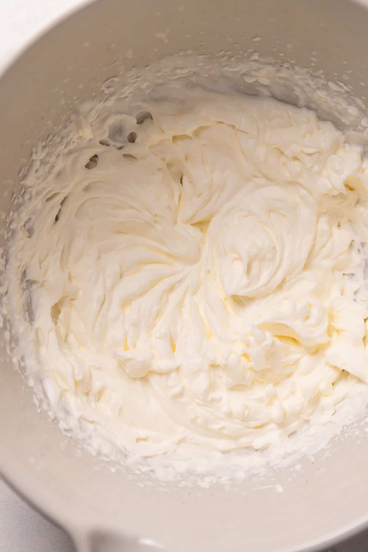 coconut whipped cream in a mixing bowl.