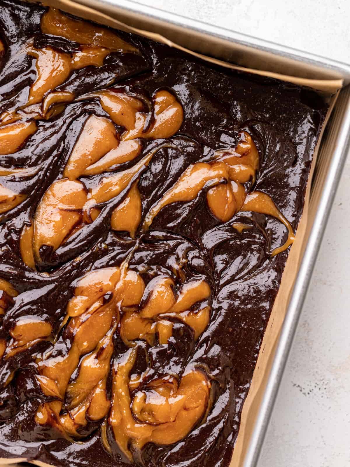 swirled caramel on top of the brownie batter.