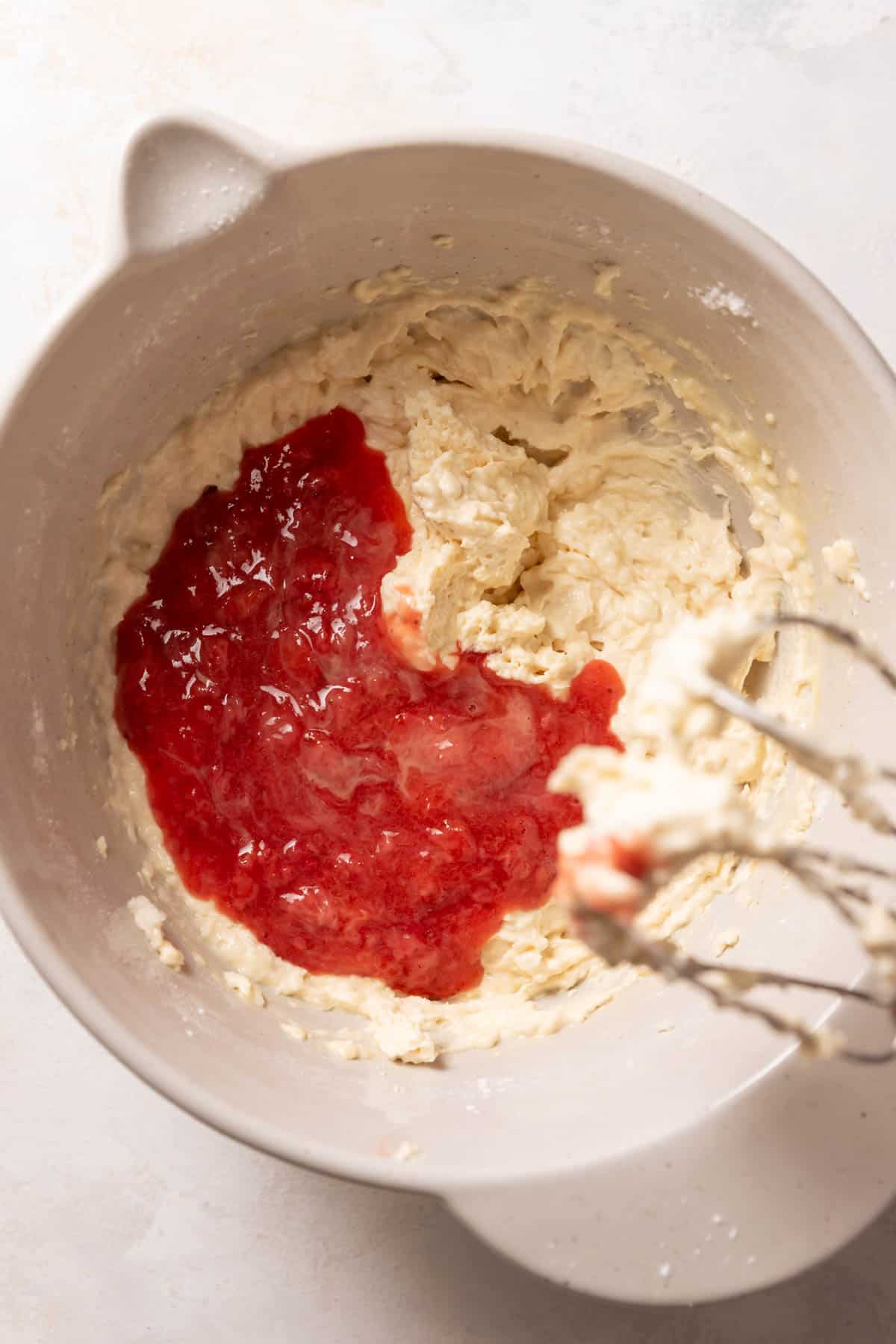 strawberry puree on top of the cake batter before mixing it in.