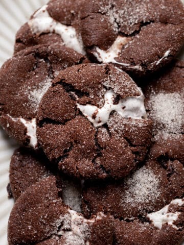 chocolate marshmallow cookies on a white plate.