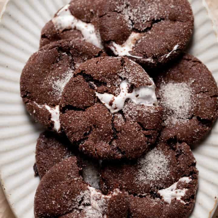 chocolate marshmallow cookies on a white plate.