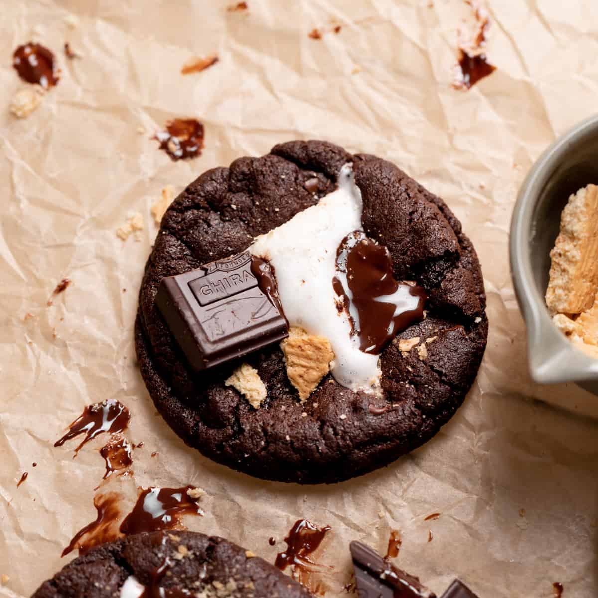 chocolate smores cookie on parchment paper.